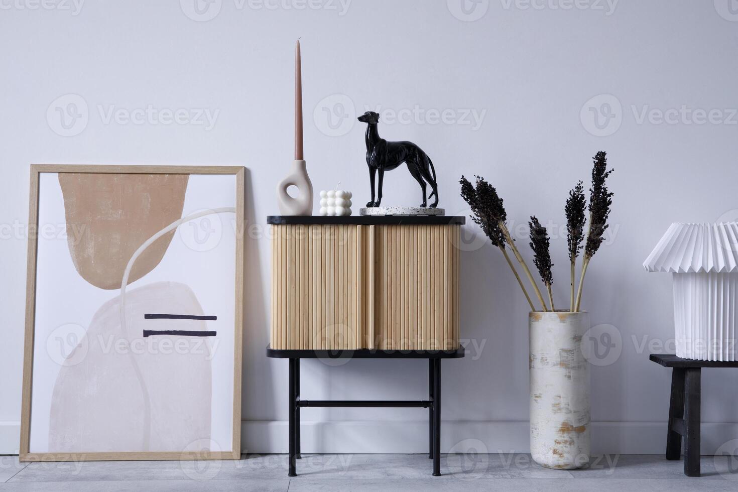 Stylish living room interior design with wooden commode, mock up poster frame and creative accessories and home decor. Modern home staging. Template. Copy space. photo