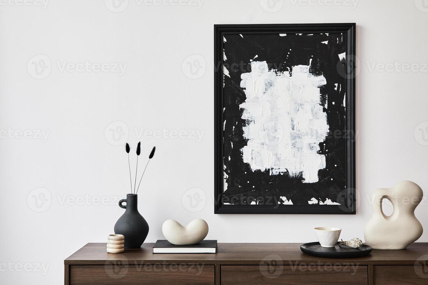 Minimalistic composition of creative living room interior with mock up poster frame and stylish small personal accessories on wooden commode. Copy space. Template. photo