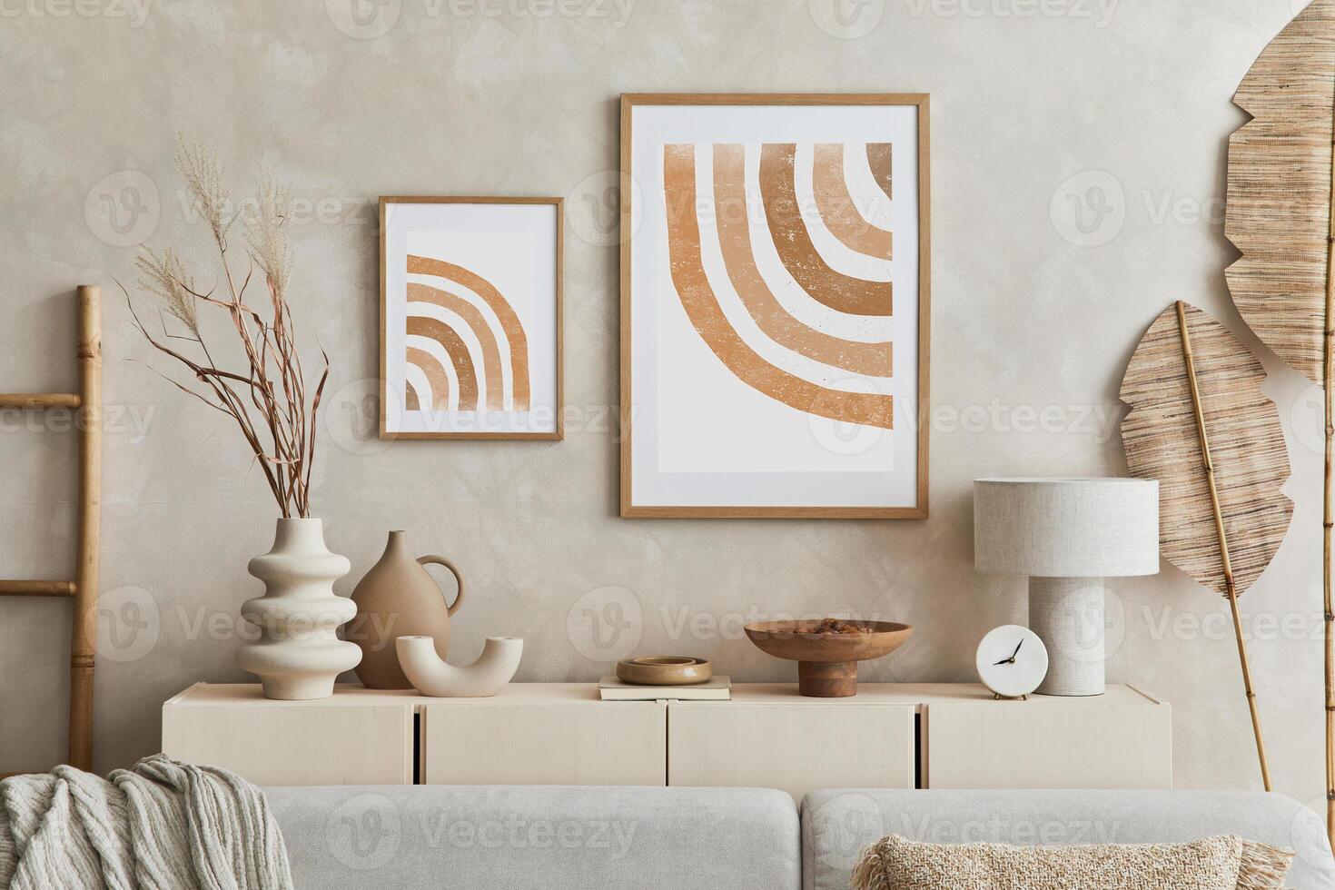 Creative composition of stylish living room with mock up poster frame, sofa, commode clay vases and stylish personal accessories. Pastel neutral colours. Template. photo