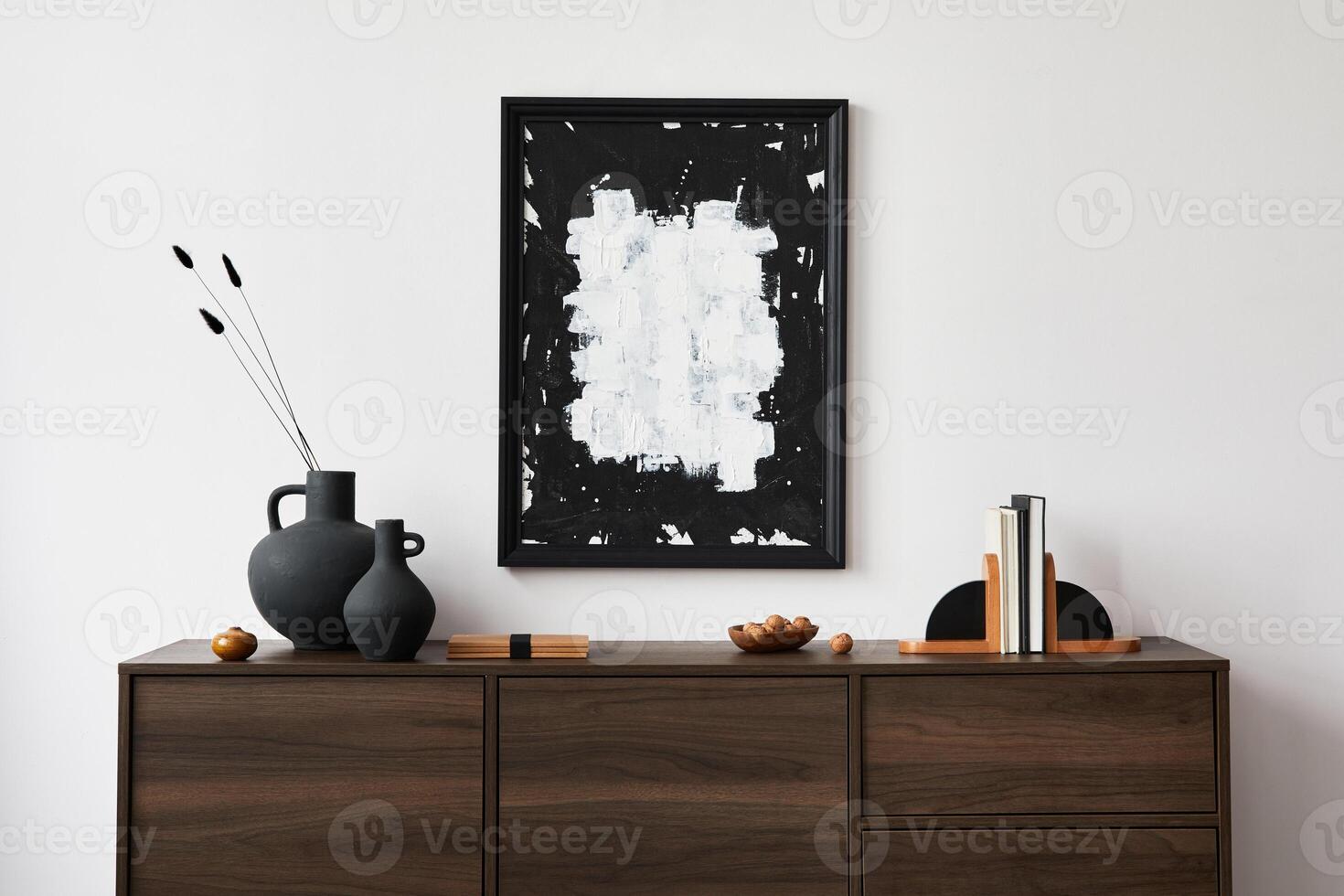 Creative composition of modern living room interior design with mock up poster frame, brown commode, vases and personal accessories. . Template. photo