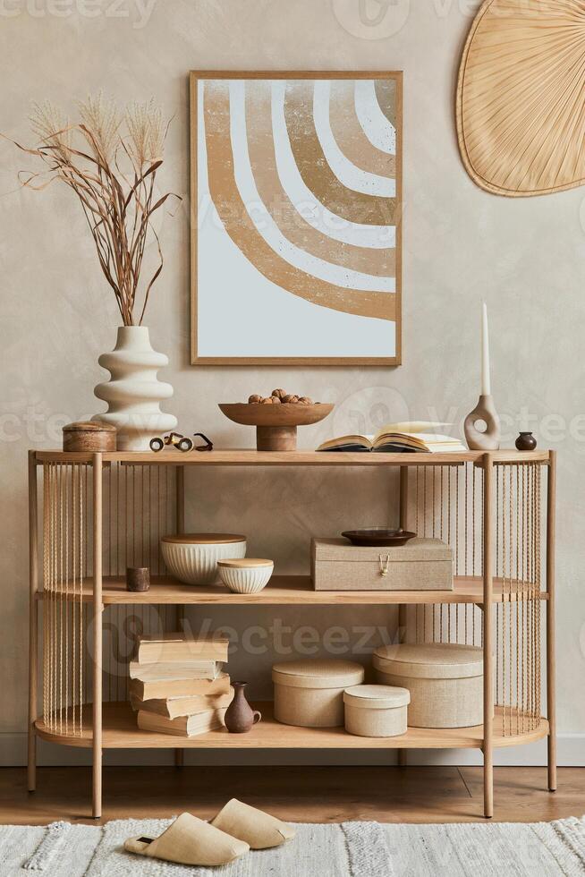 Stylish composition of living room interior design with mock up poster frame, console and stylish and elegant personal accessories as books, vases and boxes. Copy sapce. photo