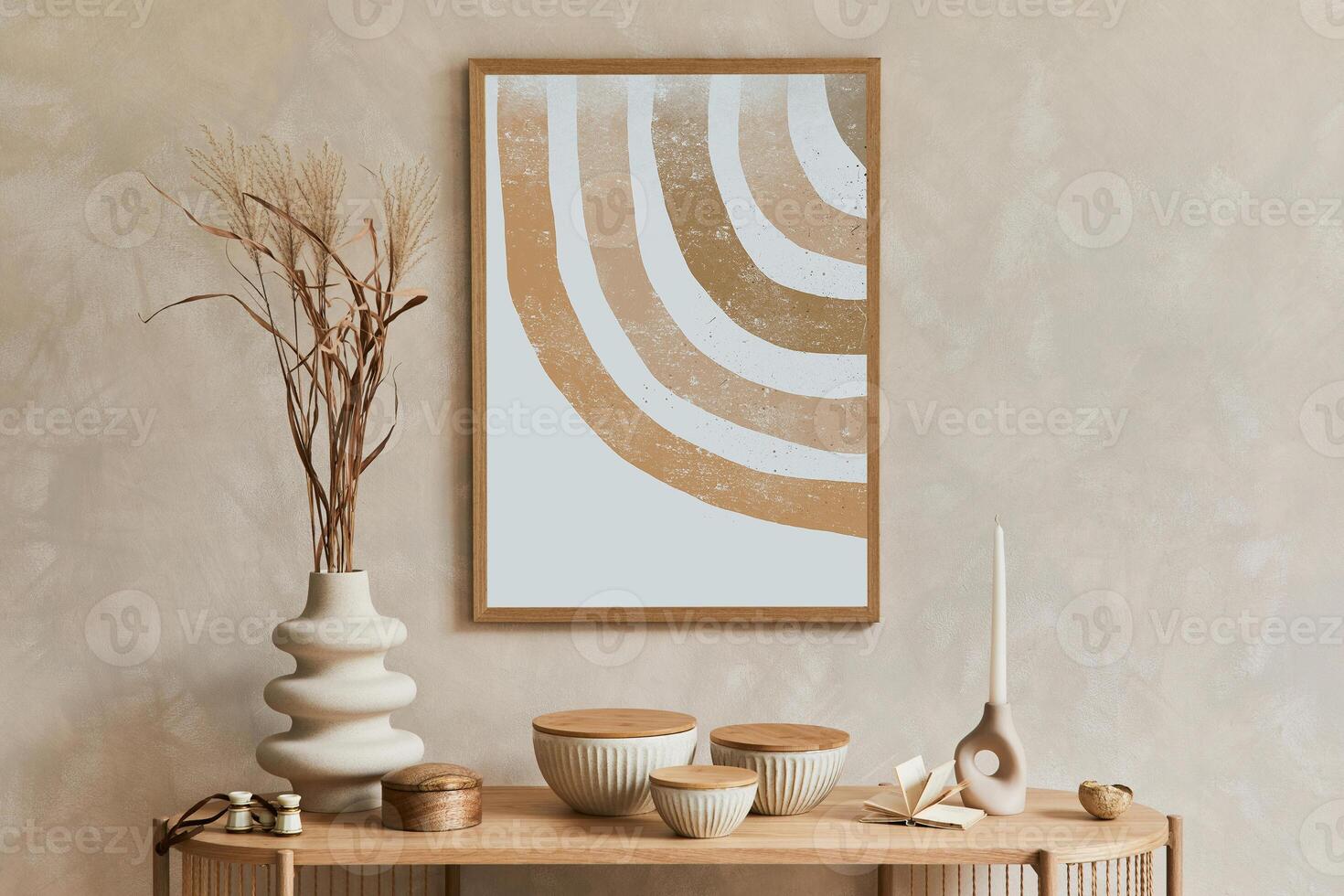 Creative interior composition with design wooden console, mock up poster frame, armchair and stylish personal accessories such as candlestick, vase and books. Copy space. photo