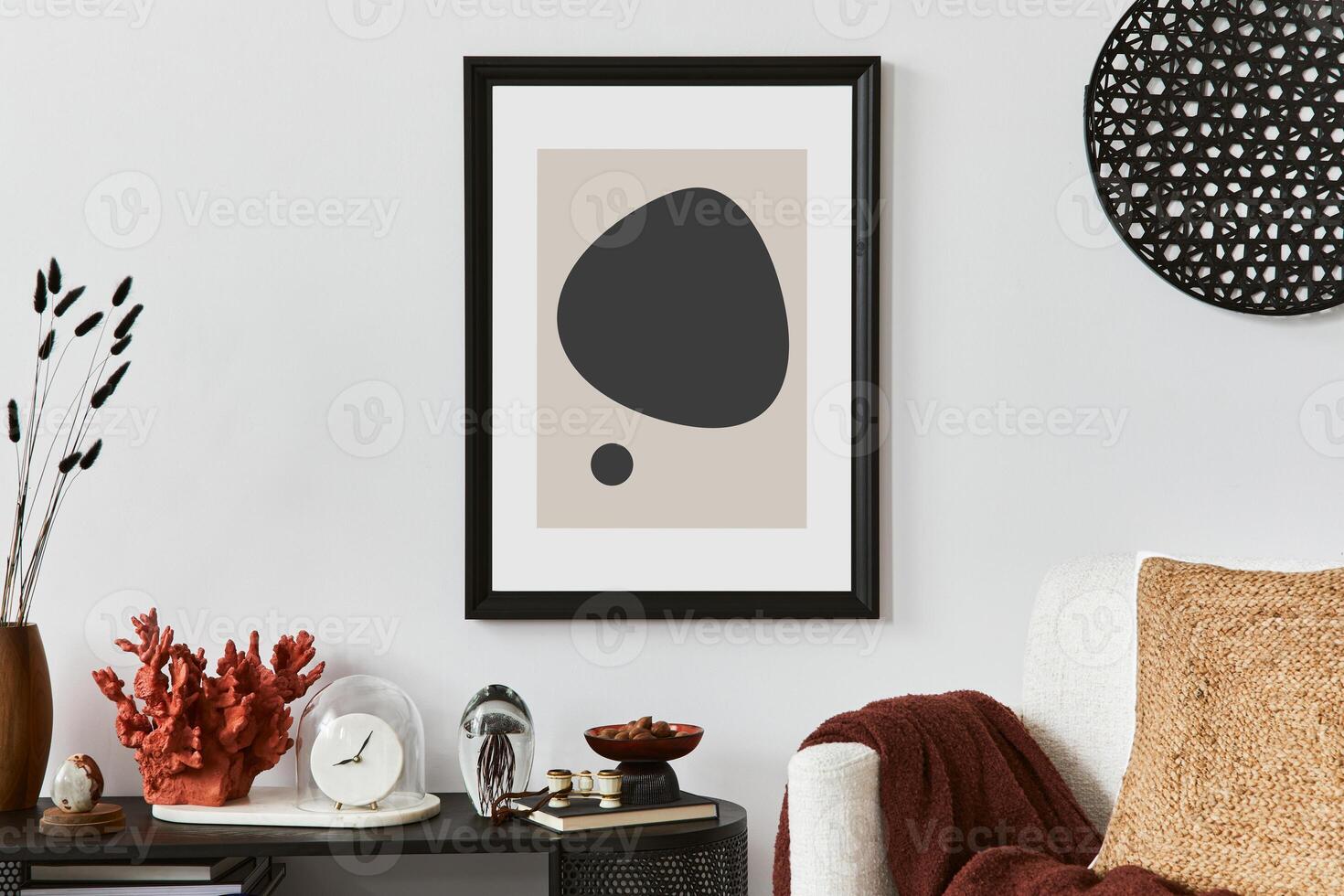 Creative living room interior composition with mock up poster frame, armchair, console and personal accessories. Copy sapce Template. photo