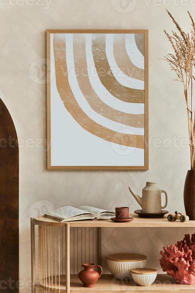 Creative composition of living room interior design with console, mock up poster frame, teapot and elegant personal accessories. Copy space. photo