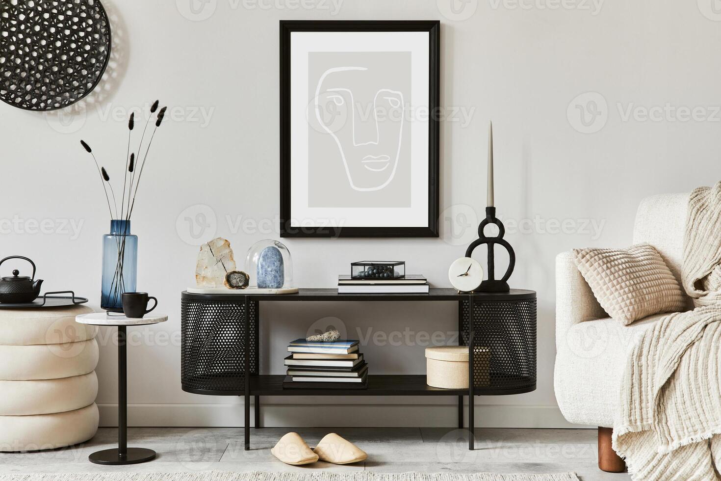 Creative composition of living room interior design with console, armchair, mock up poster frame, vase, gemstone and vintage personal accessories. Copy space - Template photo