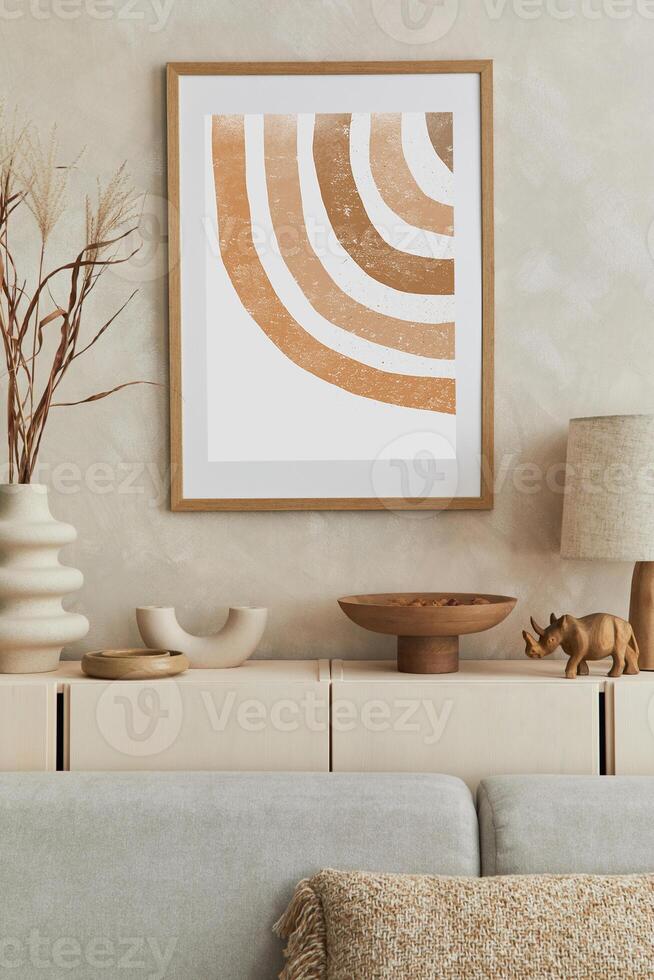 Creative composition of stylish living room interior with mock up poster frame, commode clay vases and stylish personal accessories. Pastel neutral colours. photo