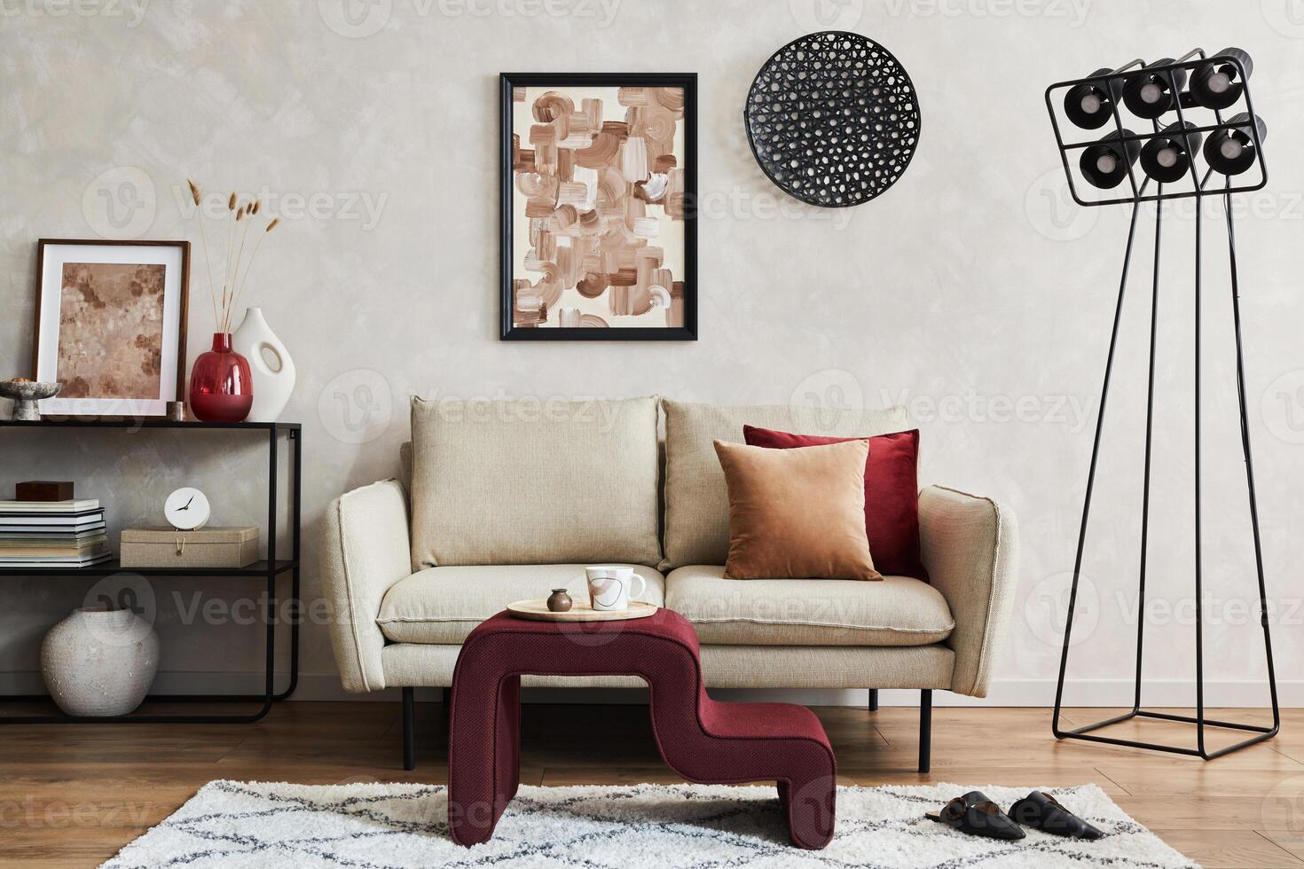 Elegant living room interior composition with beige sofa, black console, coffee table, mock up poster frame and creative design personal accessories. photo