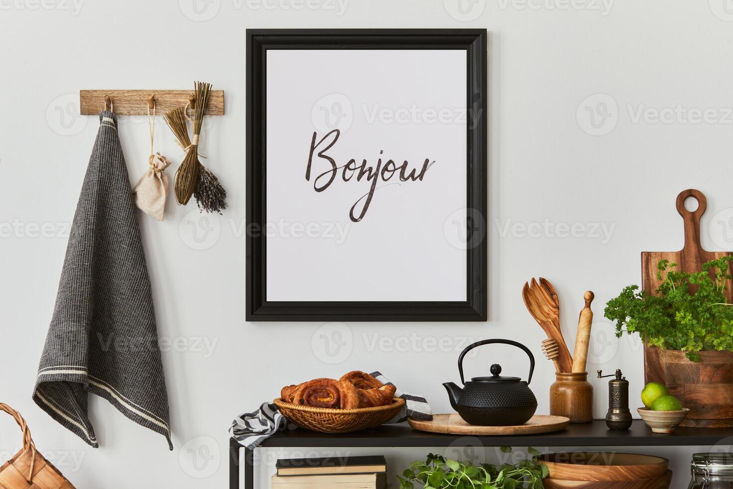Stylish and cozy kitchen interior composition with mock up poster frame, black console, kitchen textile, teapot, plants and retro inspired accessories. Template. Autumn vibes. photo