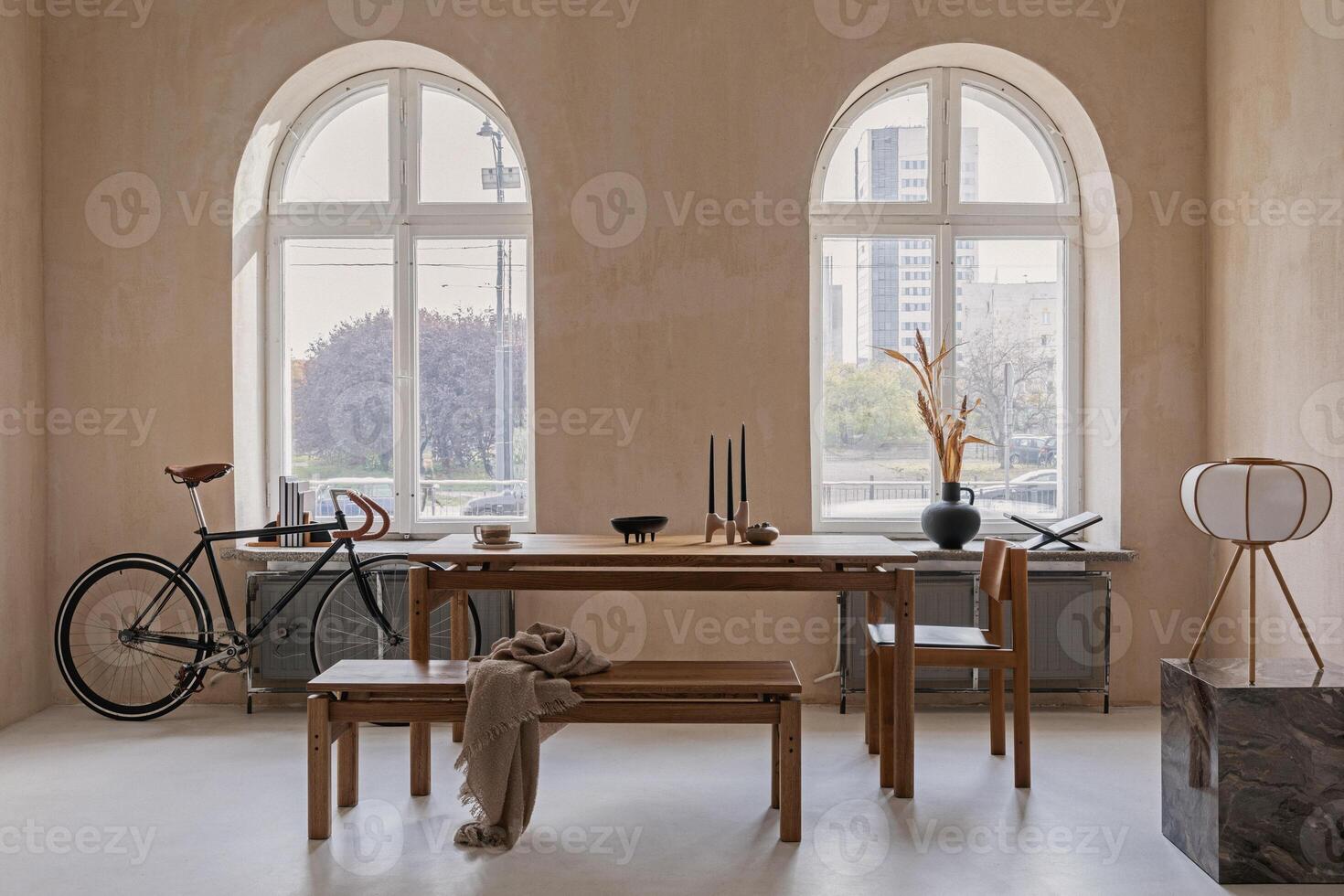 Stylish interior design of spacious dining room with wooden dining table, armchairs and personal accessories. Modern home decor. Structure wall. Rustic minimalitic inspiration. Template. photo