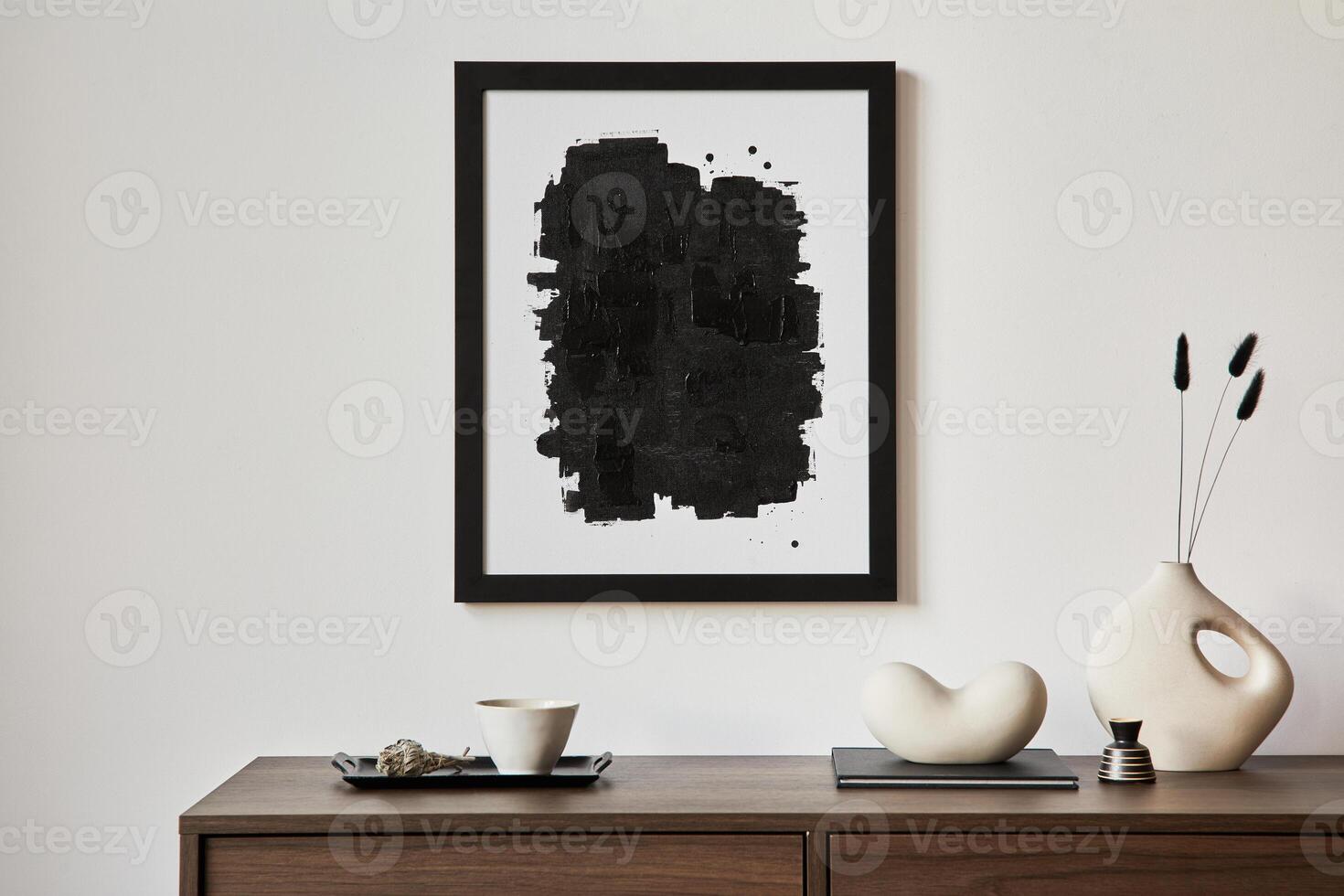 Minimalistic composition of creative living room interior with mock up poster frame and stylish small personal accessories on wooden commode. Copy space. Template. Real photo