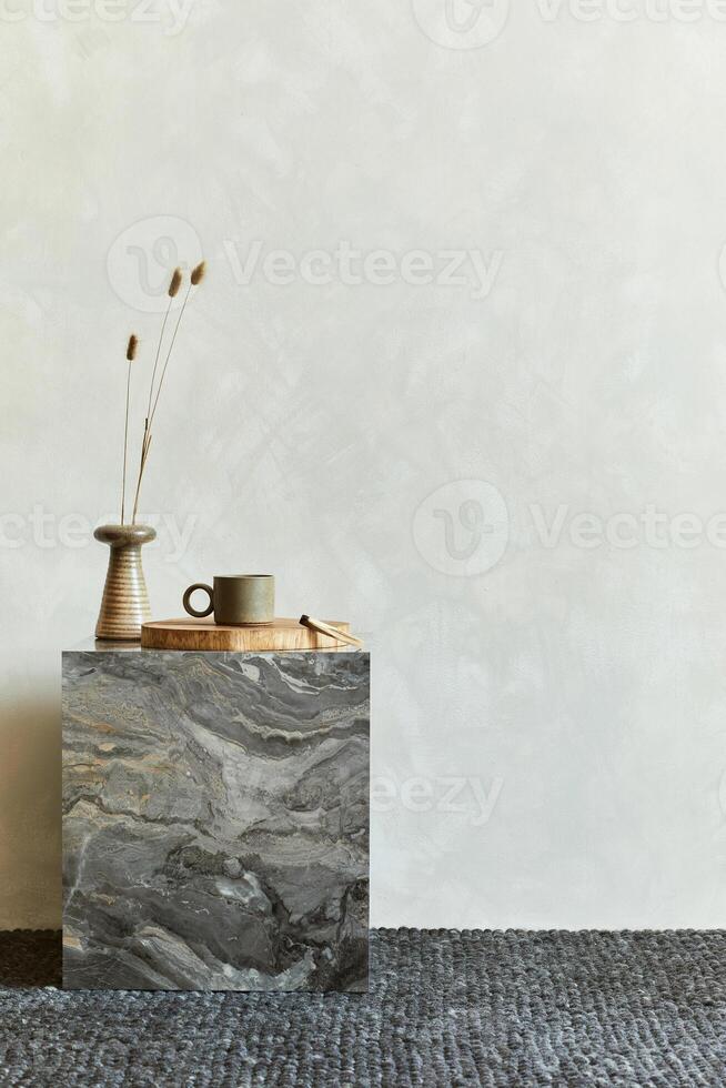 Creative interior composition with design marble cube coffee table and stylish personal accessories Copy space. Template. photo