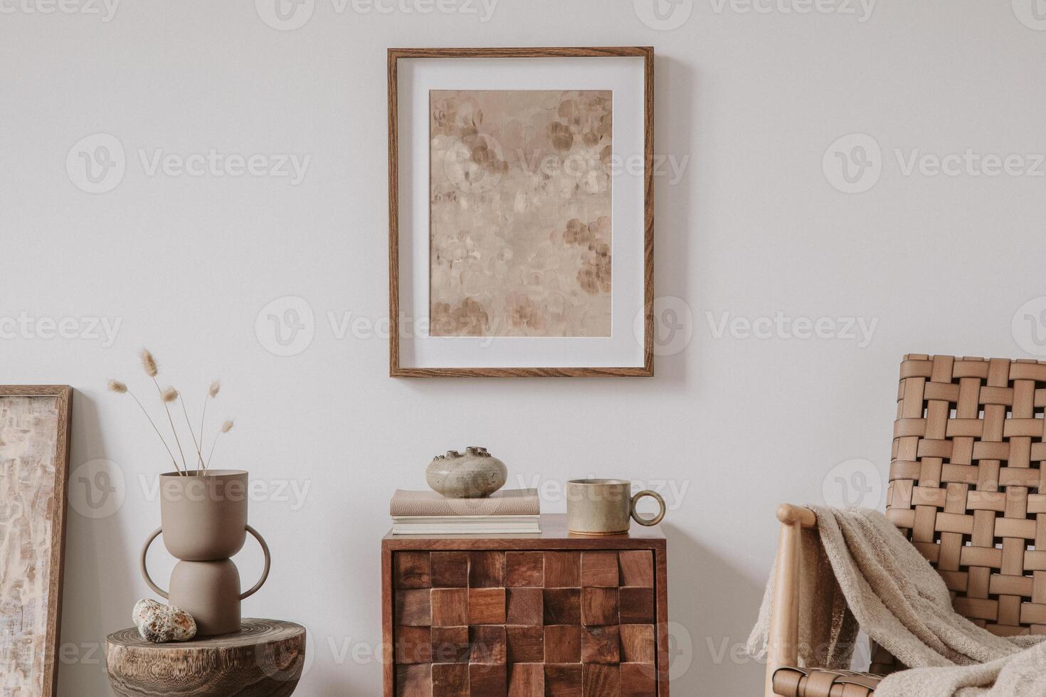 Elegant comosition of masculine room decor with small wooden cupboard, two mockup paintings and vintage accessories. Home staging. Template. Copy space. photo