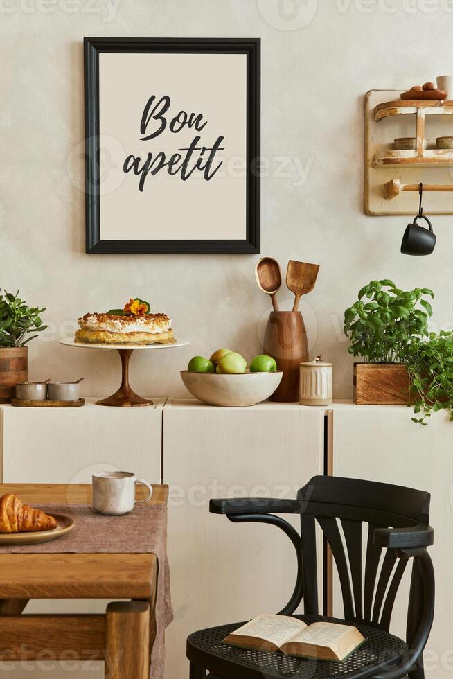 Stylish composition of cozy kitchen interior design with mock up poster frames, beige commode, wooden table, chair and bench and kitchen accessories photo
