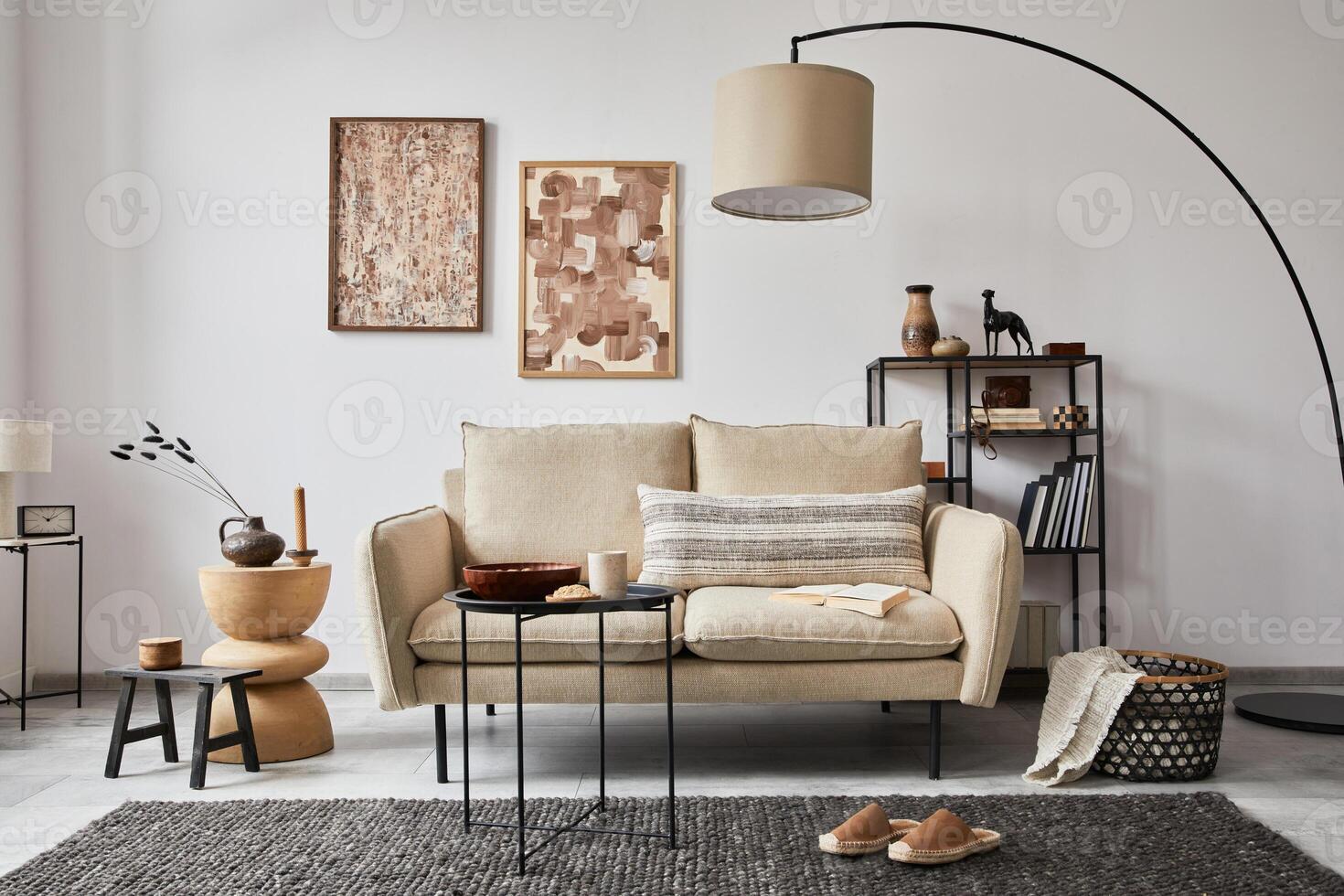 Creative composition of modern living room interior with mock up poster frames, beige sofa, side table and stylish small personal accessories on metal shelf. Copy space. Template. photo