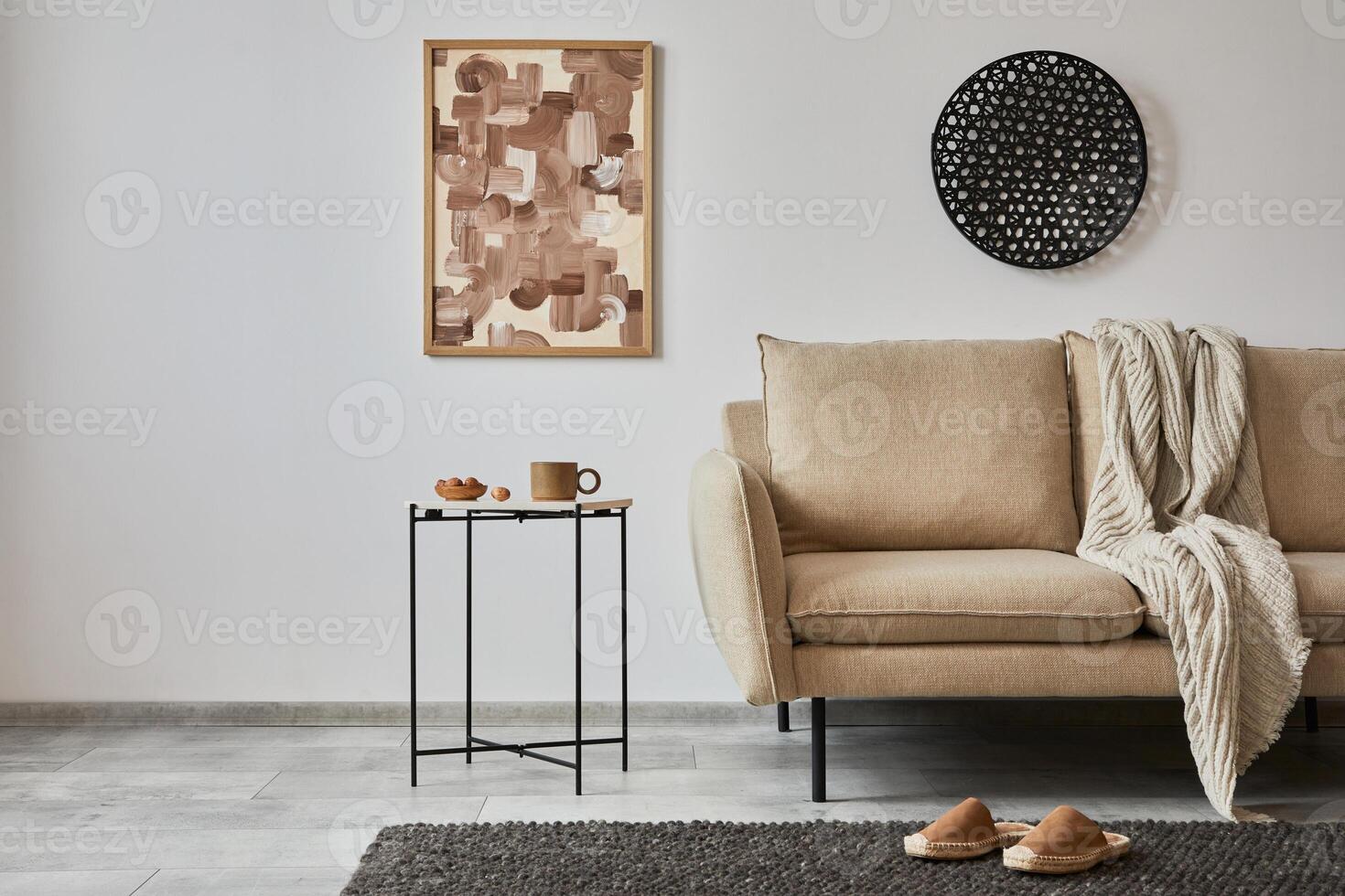 Minimalist interior of elegant living room with mock up poster frame, beige modern sofa, side table and personal accessories. Creative home staging. Copy space. Template. photo