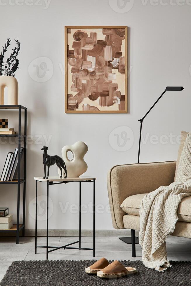 Stylish composition of elegant living room interior design with mock up poster frame, metal and wooden shelf, sofa, vintage vases and personal accessories. White wall. Copy space. Template. photo