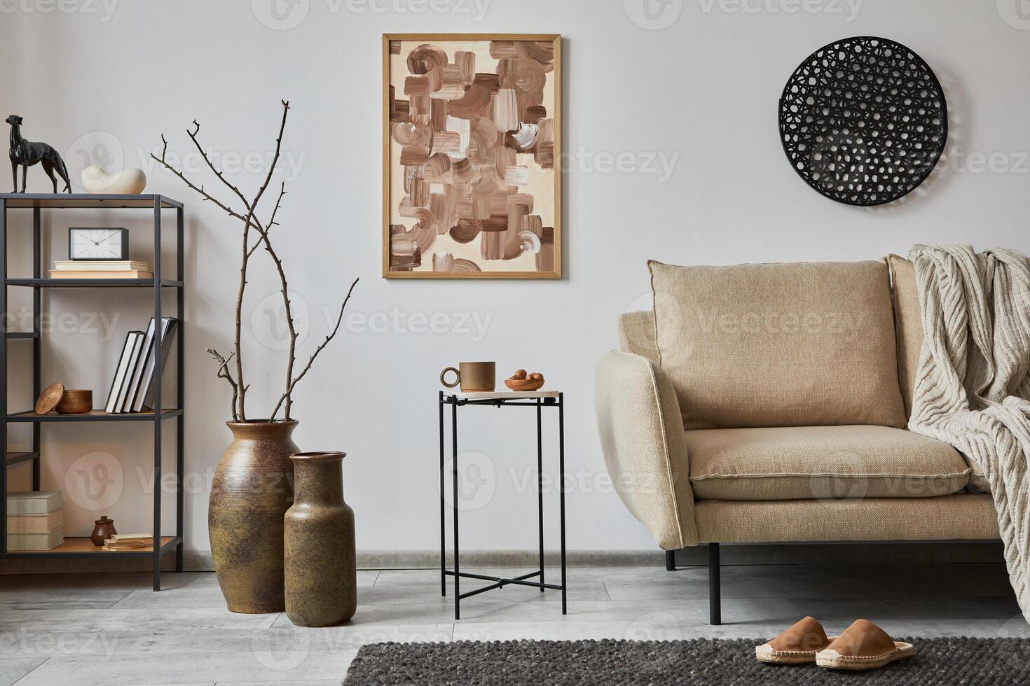 Minimalist interior of elegant living room with mock up poster frames, beige modern sofa, side table, retro vases and personal accessories. Creative home staging. Copy space. Template. photo