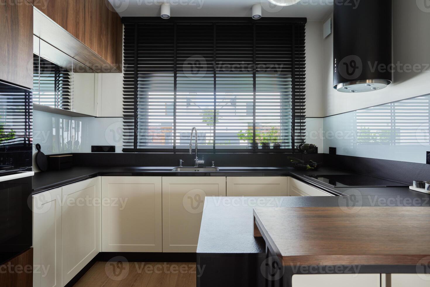 Minimalistic creative brown panel kitchen interior with biuld-in kitchen and kitchen island. Geometric forms and shapes. Template. photo
