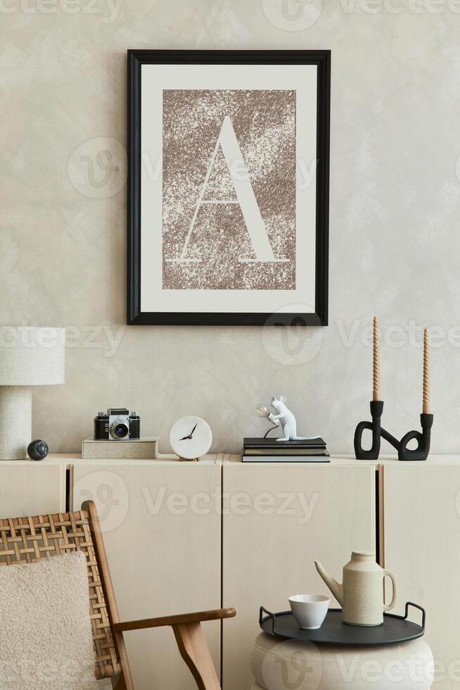 Elegant composition of stylish living room intrerior with mock up poster frame, beige sideboard and minimalistic personal accessories. Copy space. Template. photo