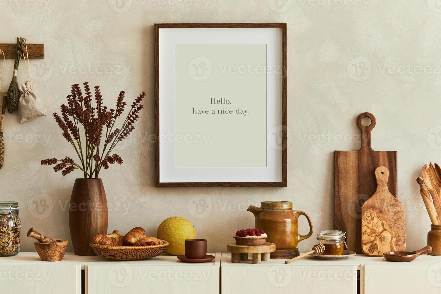 Stylish and modern kitchen interior with mock up poster frame, beige wooden sideboard, plants and retro inspired accessories. Template. Autumn vibes. photo