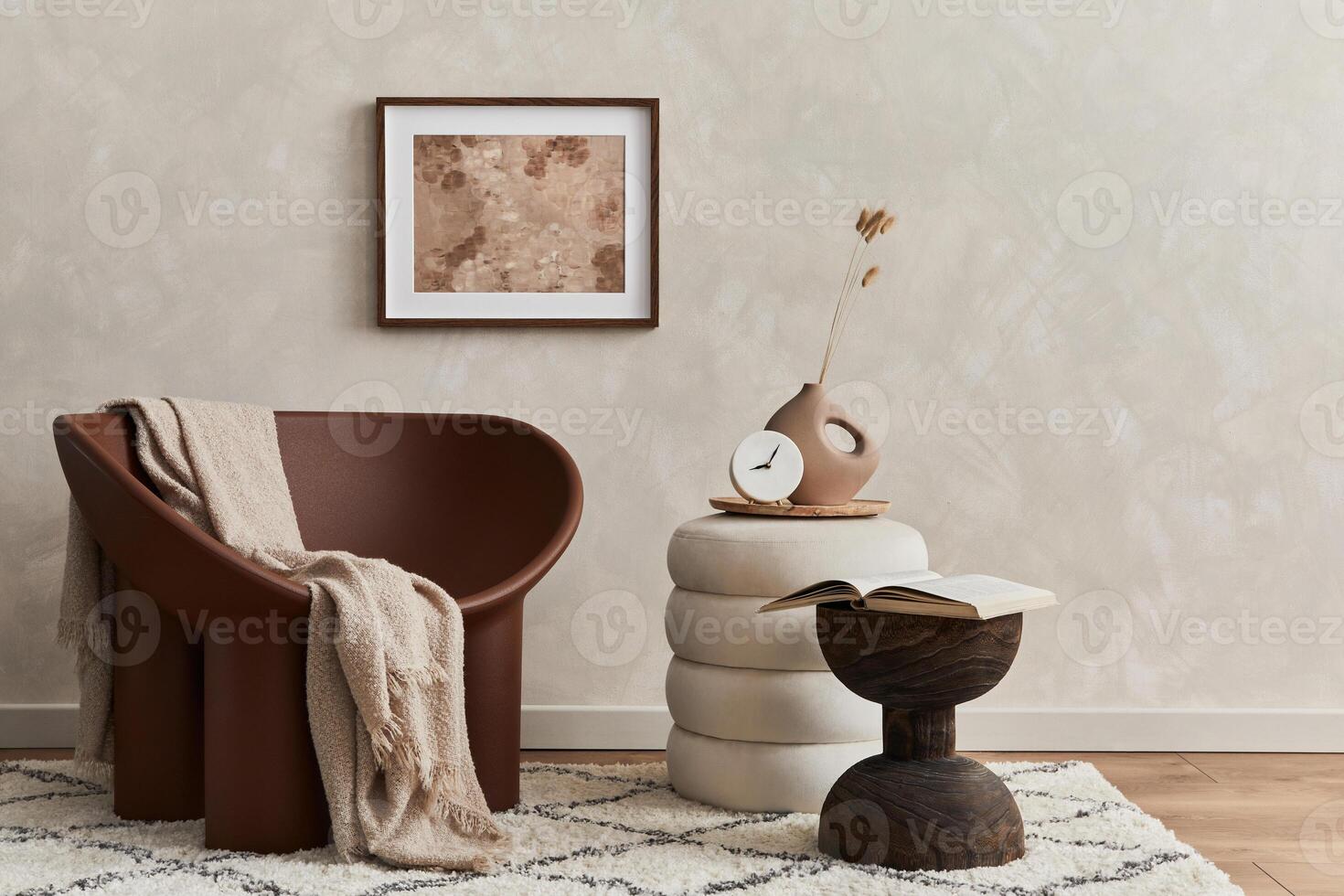 Minimalistic composition of elegnat living room with creative armchair, mock up poster frame, coffee table, pouf and stylish personal accessories. Copy space. Template. photo