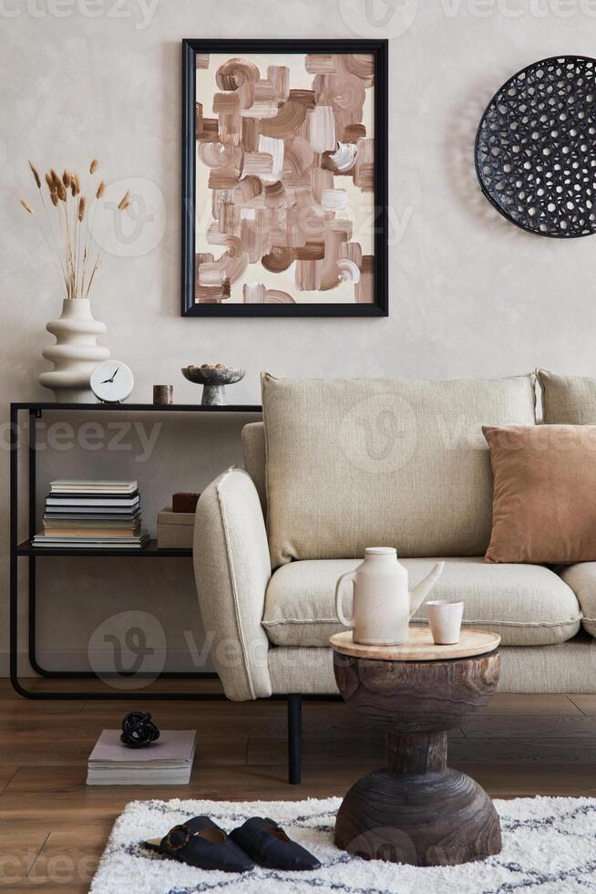 Elegant interior of living room with beige sofa, black console, mock up poster frame and stylish home decor. Template. photo