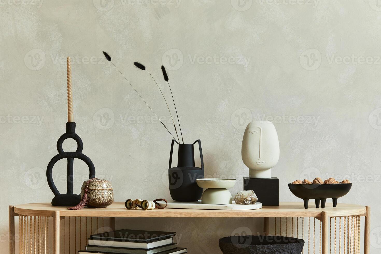 Stylish composition of personal accessories on the console in the living room. Sculpture, candlectick, minerals and tray. Copy space - Template photo