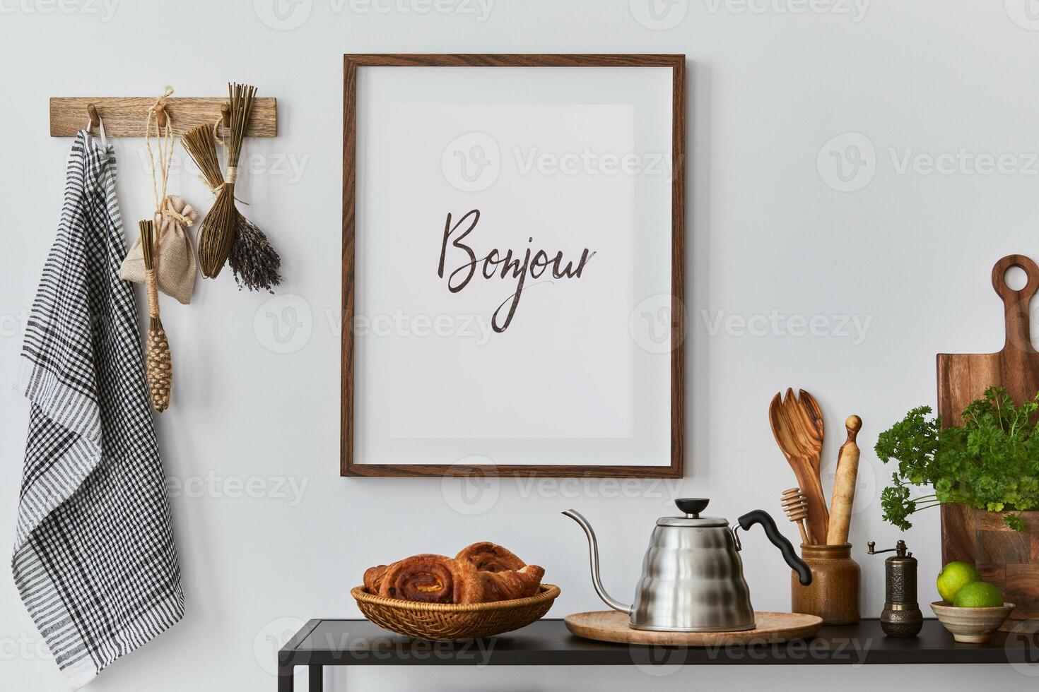 Stylish and cozy kitchen interior composition with poster frame, black console, kitchen textile, teapot, plants and retro inspired accessories. Template. Autumn vibes. photo