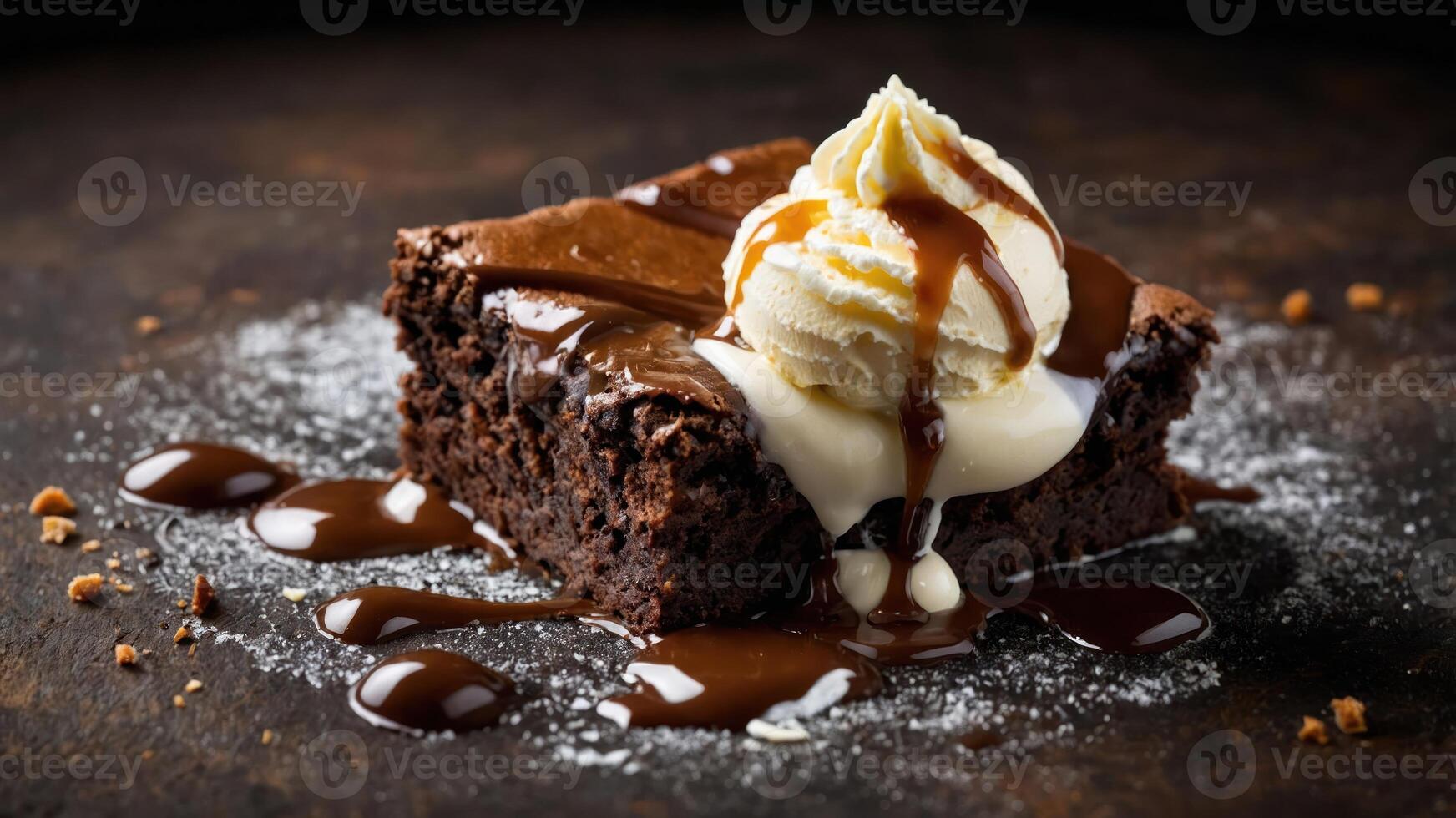 A decadent chocolate brownie topped with ice cream and drizzled with sauce. photo