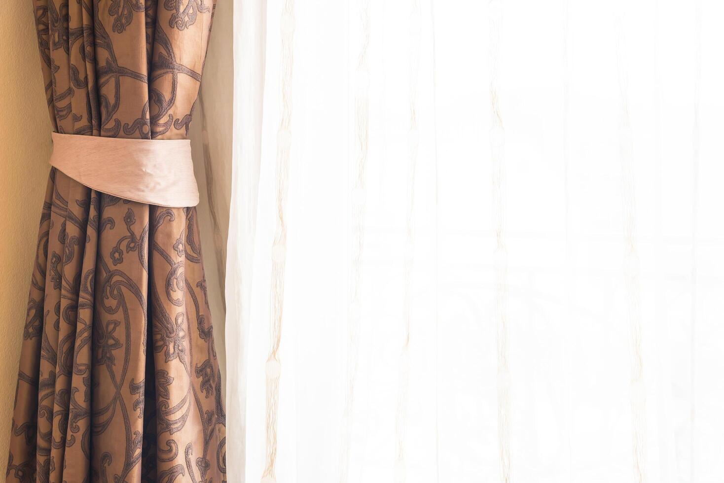 A window with curtains and a curtain rod photo