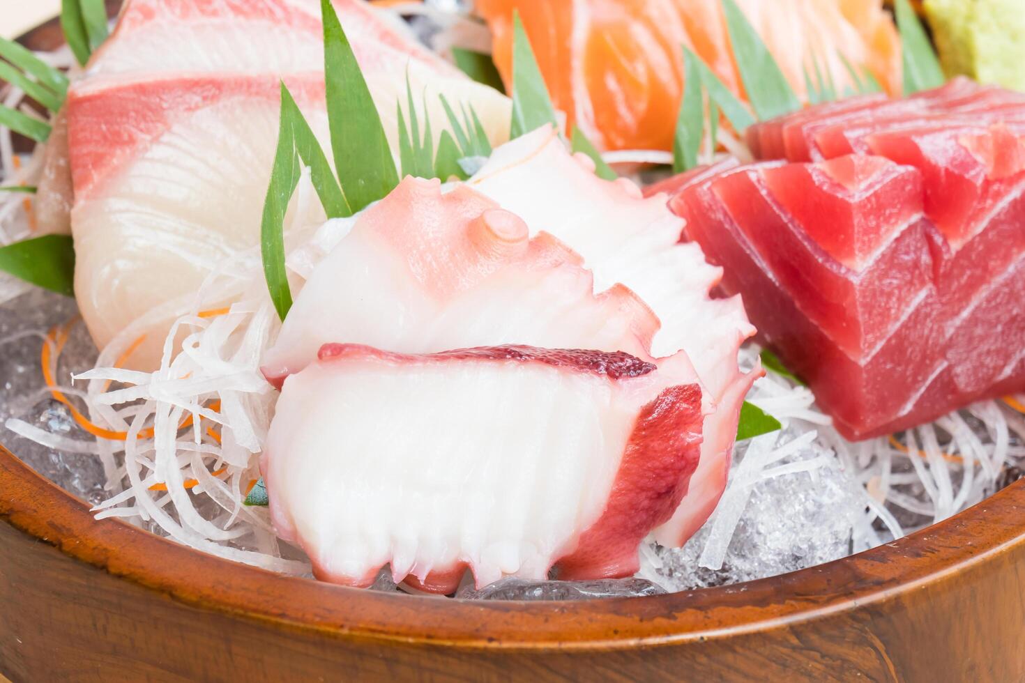 A bowl of sushi with various types of fish photo