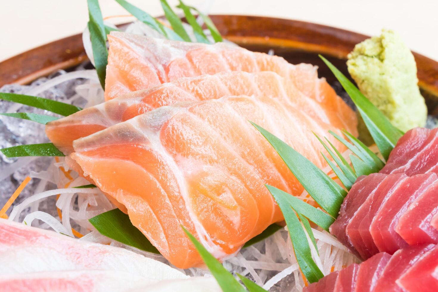 A bowl of sushi with different types of fish photo