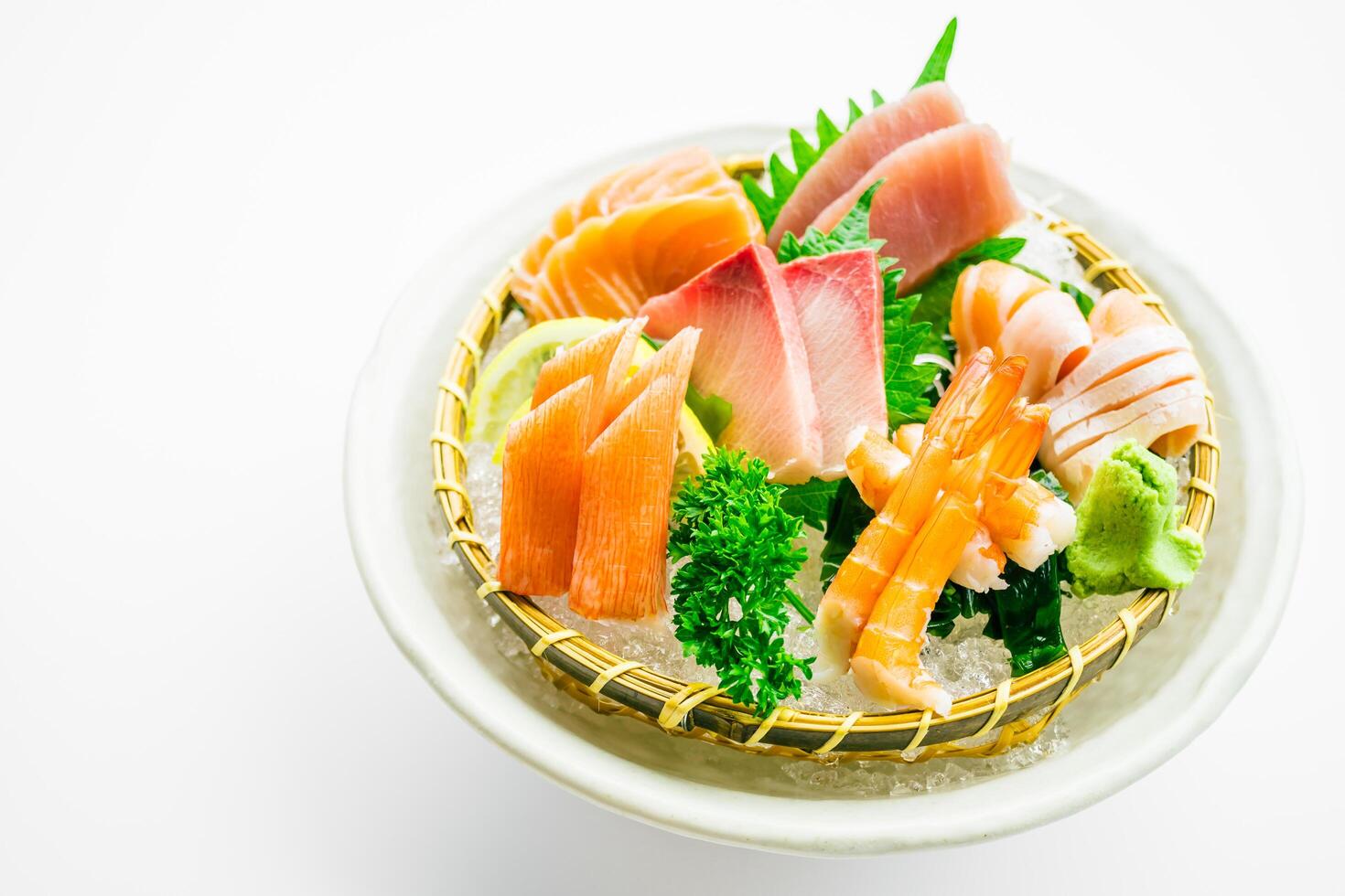 A bowl of sushi with various types of fish photo