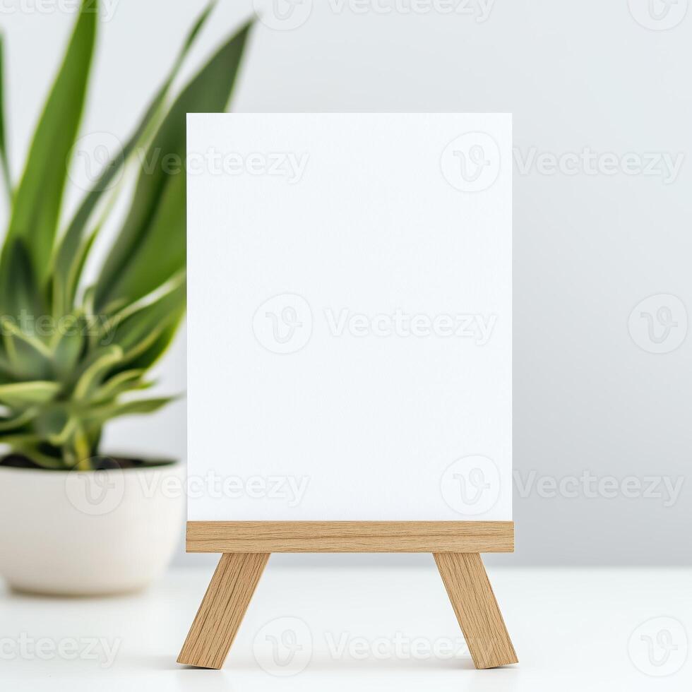 A blank A5 landscape card standing upright on a wooden stand against a white background, creating a warm and inviting atmosphere photo