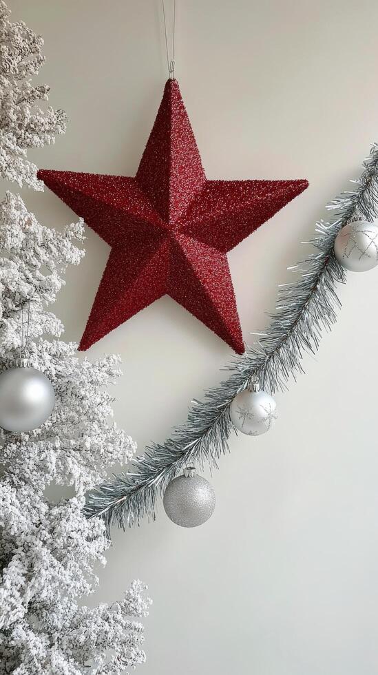 Holiday decorations featuring a red star ornament and festive embellishments on a white background photo