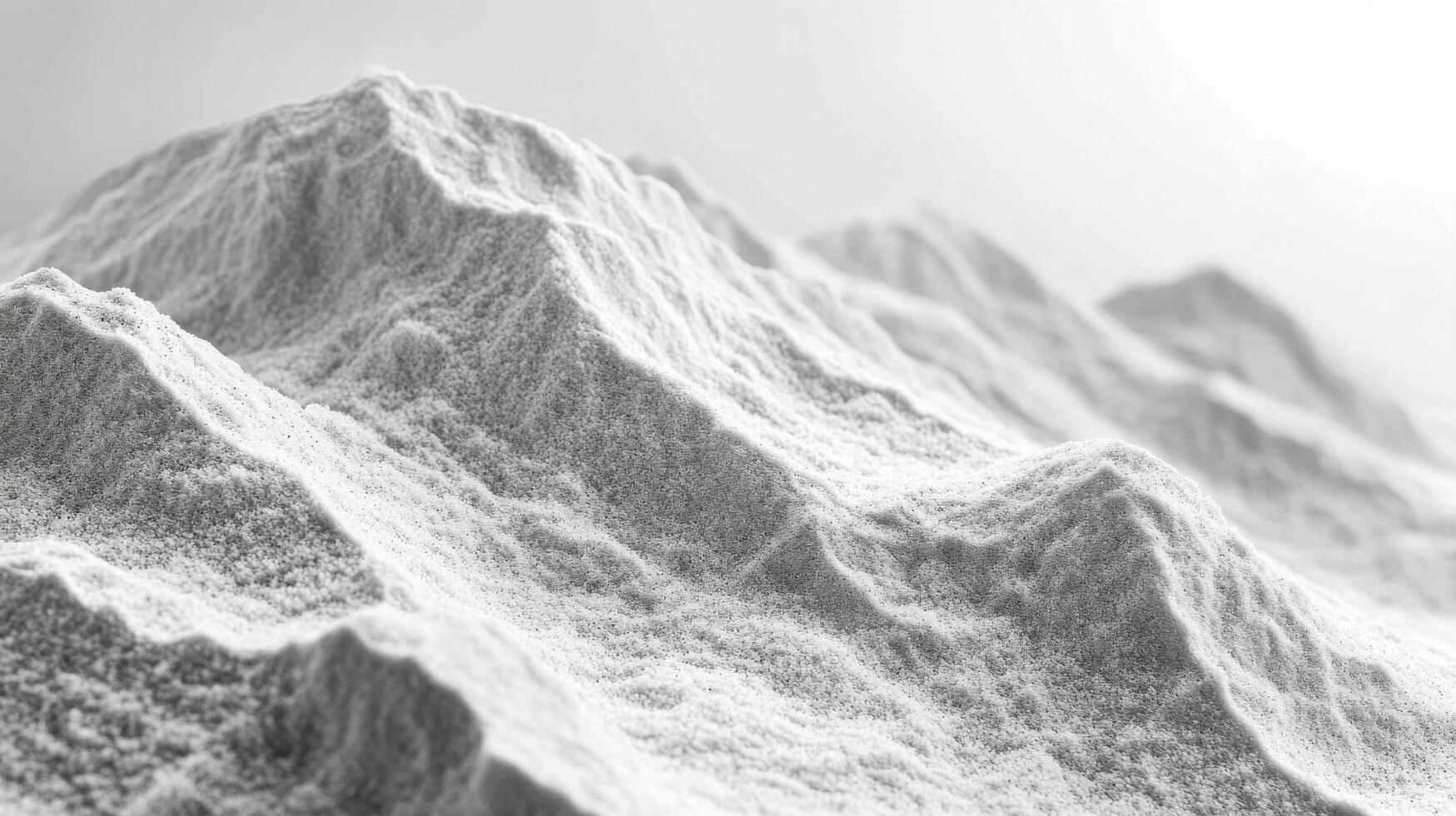 Close up view of fine sand with varied textures and shades illuminated by natural light photo