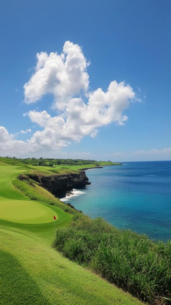 Stunning coastal golf course located in tropical paradise with views of mountains and ocean photo