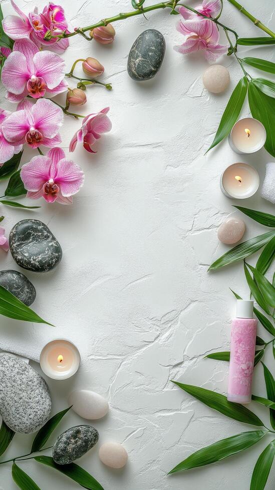 A serene spa setting with flowers, stones, and candles on a calming white surface photo