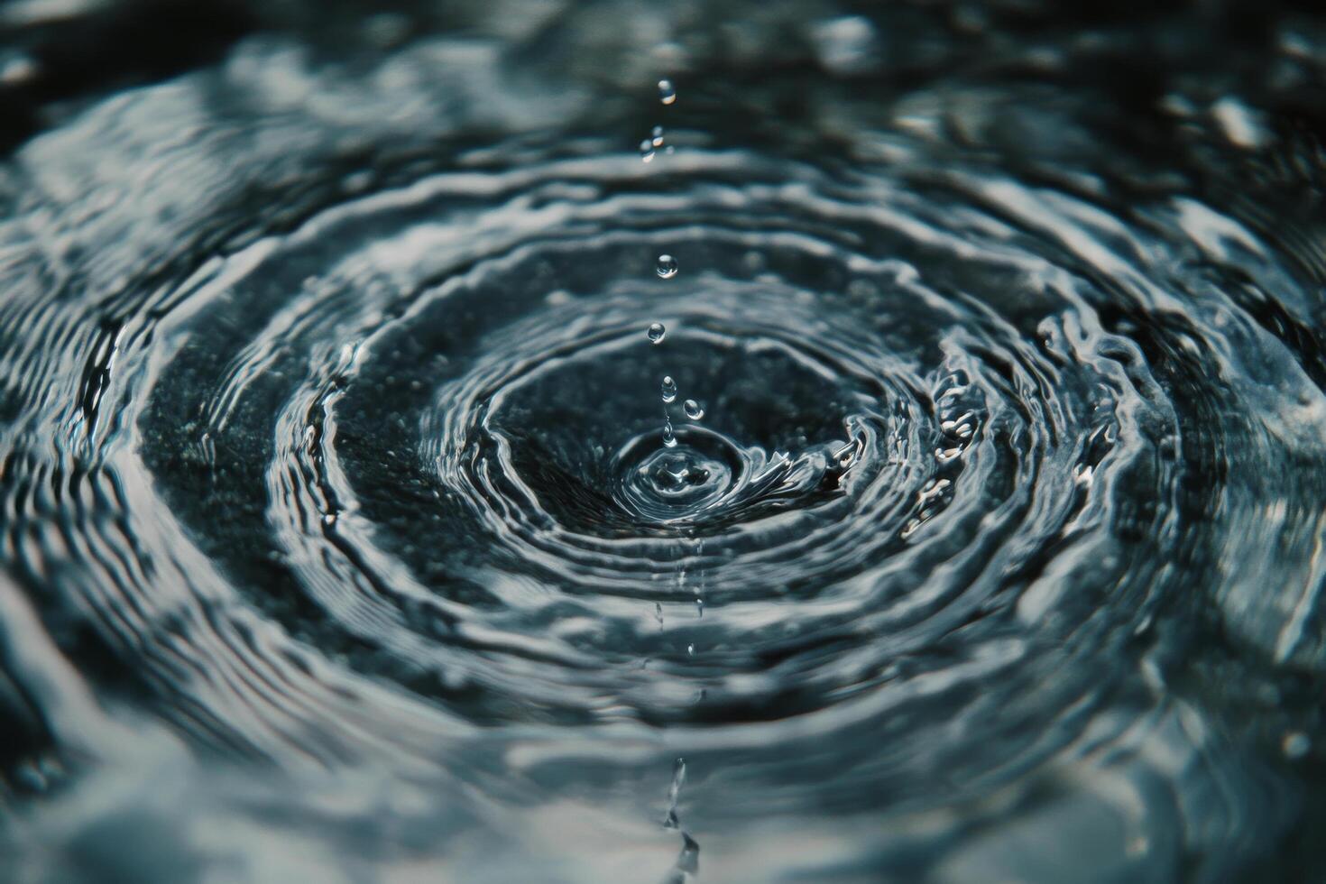 Water droplets creating ripples in a calm pond on a serene afternoon photo