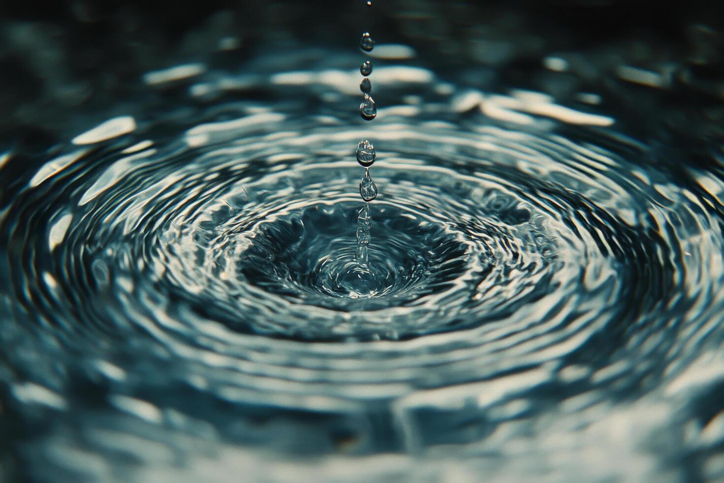 Water droplets creating ripples in a calm pond on a serene afternoon photo