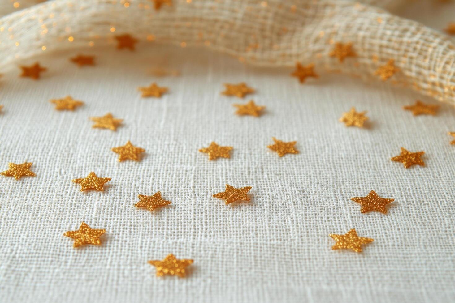 A multitude of golden stars scattered across a white background for creative decoration photo