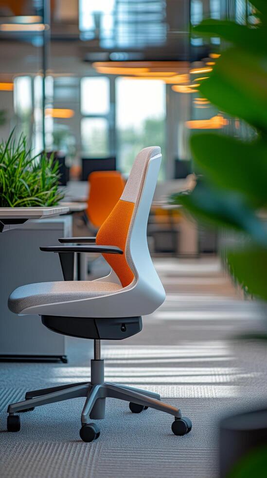 Modern office workspace featuring an ergonomic chair and green plants in a bright environment photo