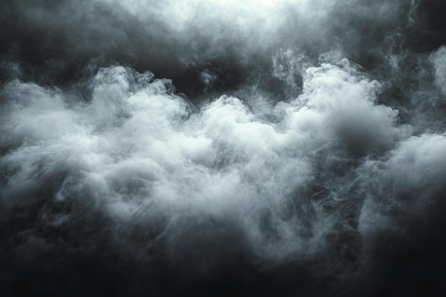 Thick white smoke drifts over a dark background, creating a mysterious surreal atmosphere photo