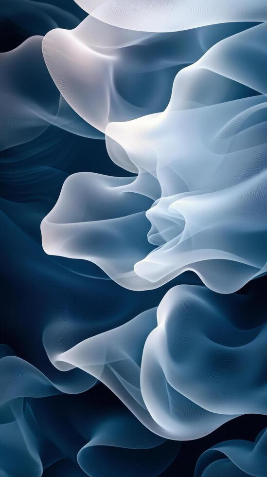 Swirling clouds of mist in shades of blue and white during twilight by a calm surface photo