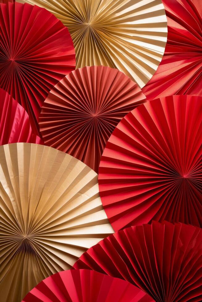 Decorative fans in red and gold arranged in a beautiful display for a festive event photo
