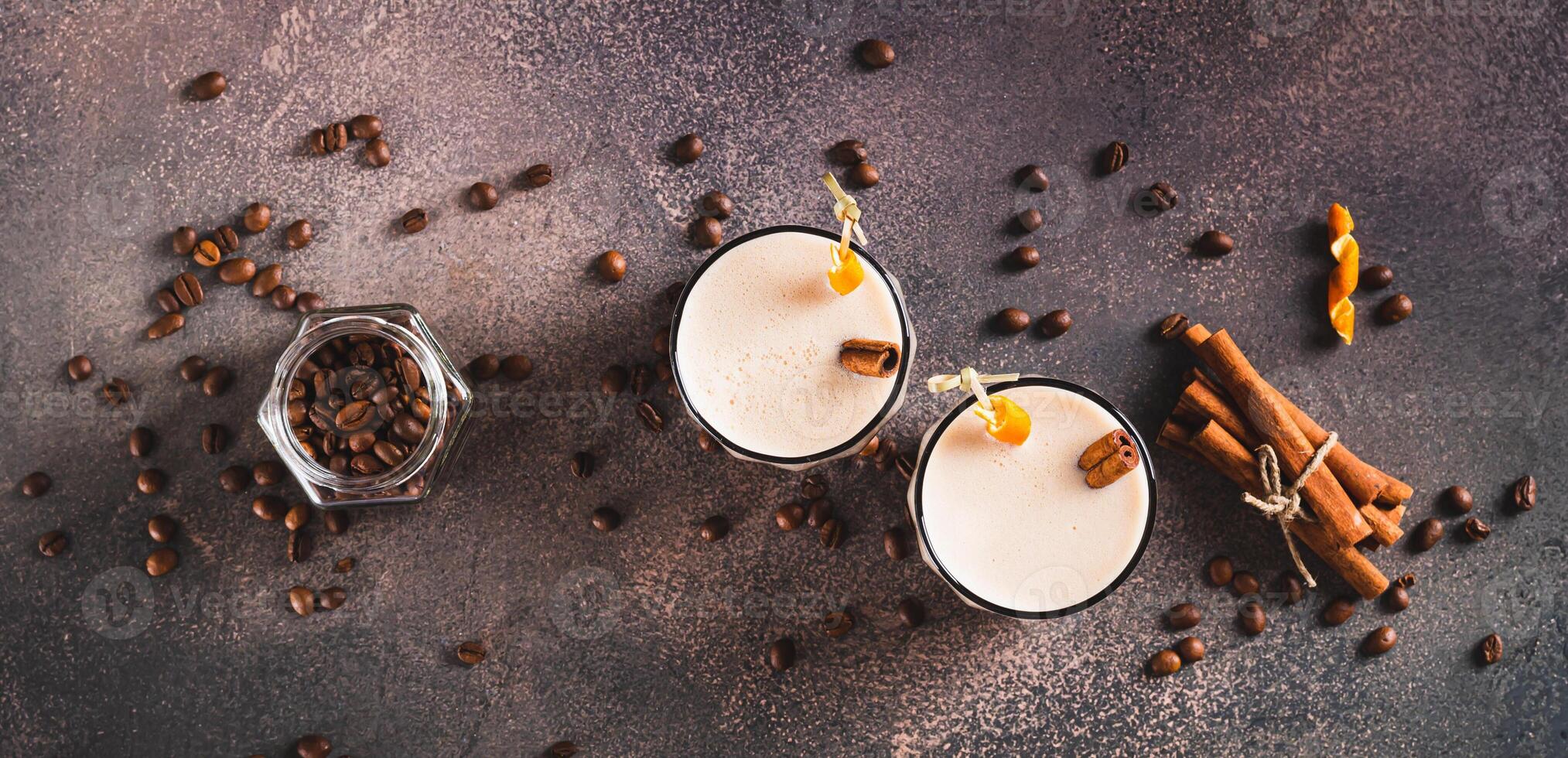 Carajillo cocktail of espresso and liqueur in glasses on table top view web banner photo