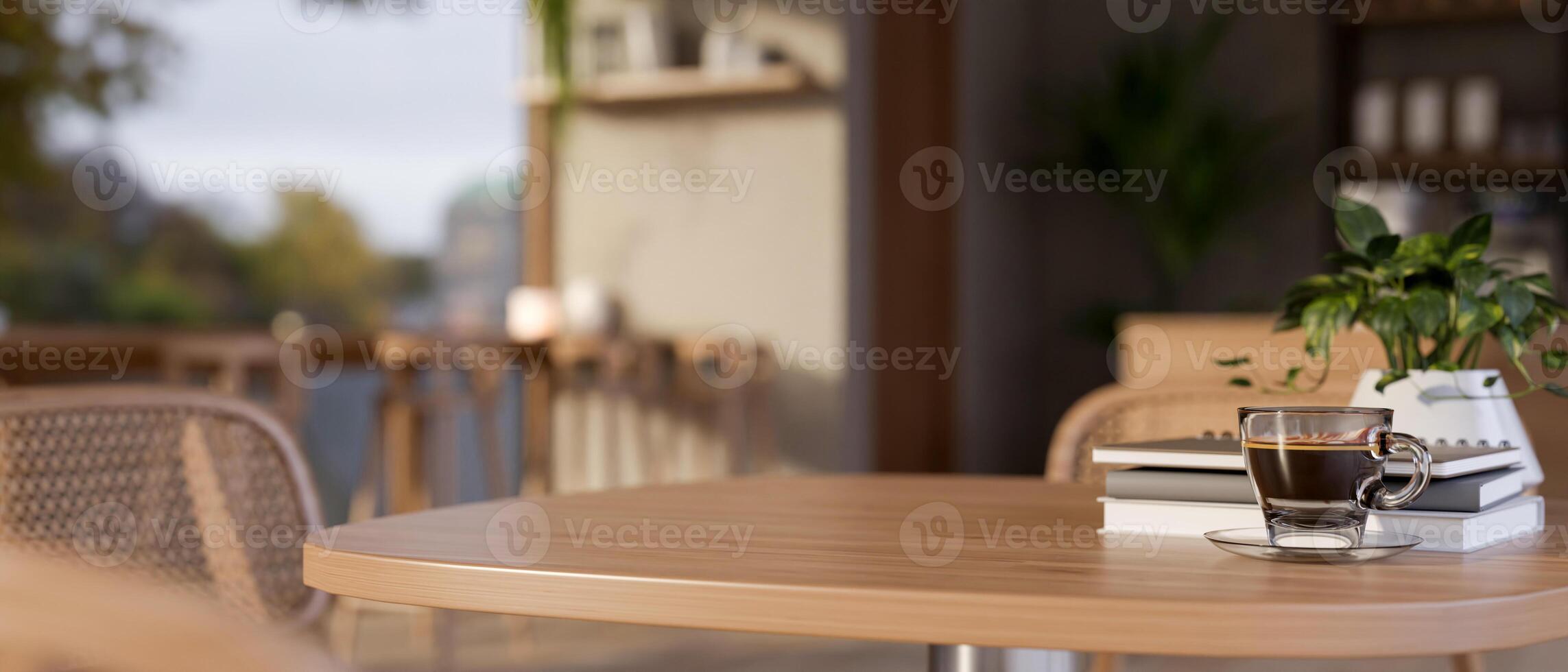 A close-up of a wooden table in a contemporary, cozy coffee shop. image with a copy space photo