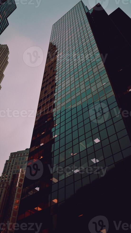 Looking Up at a Tall Building With Many Windows photo