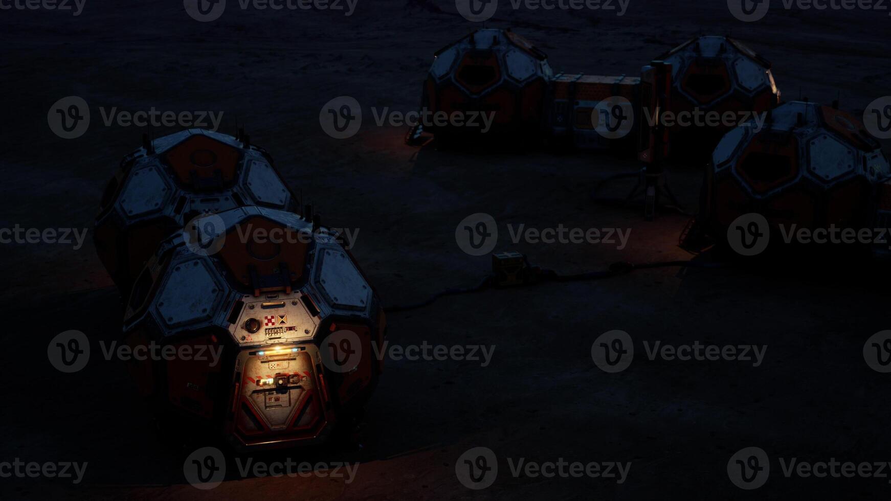 Mars colony base illuminated at night with habitat modules and equipment photo