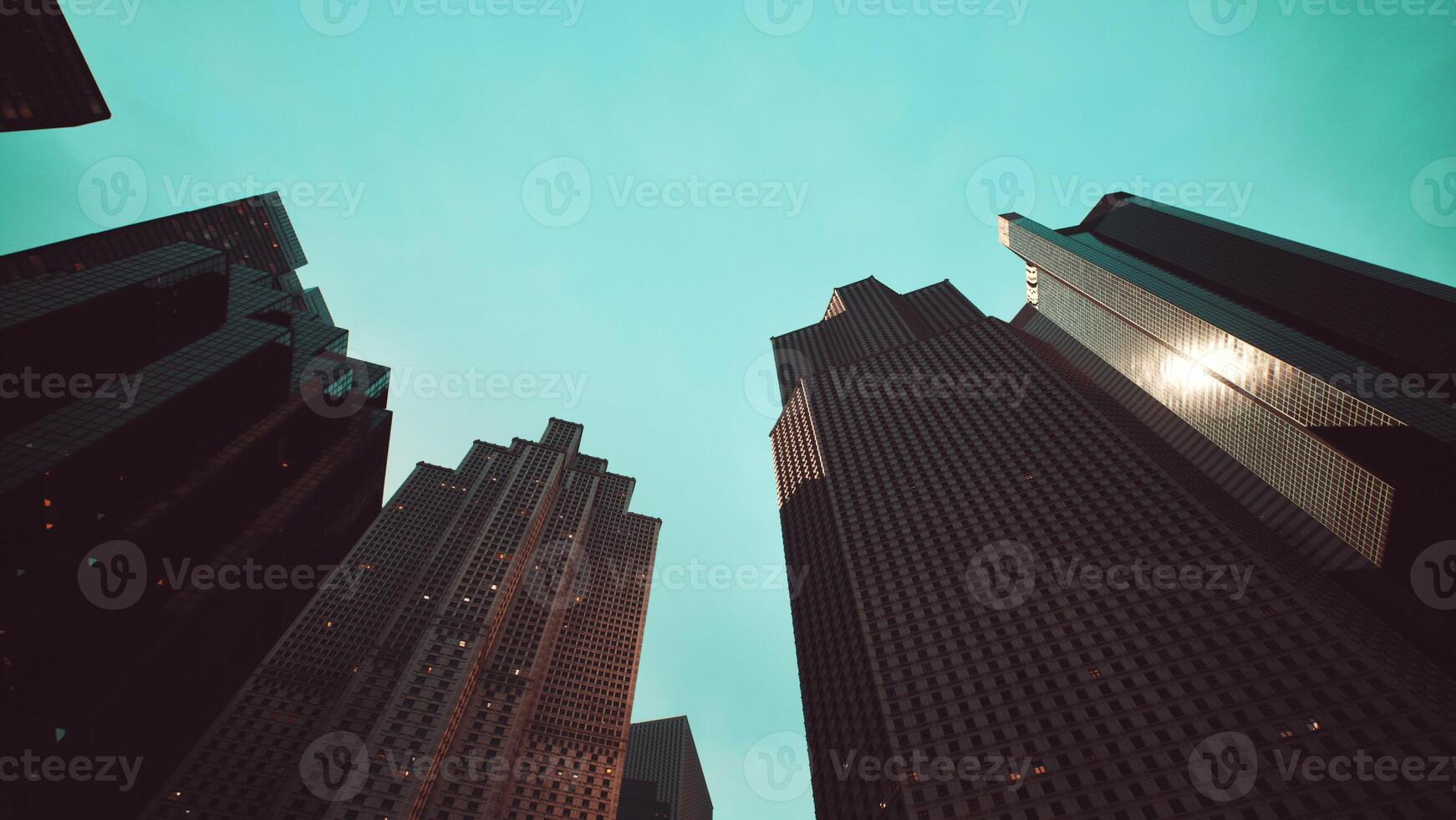 Tall buildings towering over a bustling cityscape photo